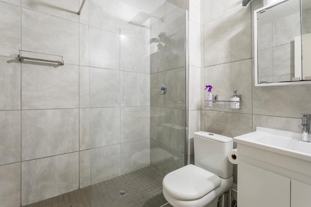 Bathroom with a walk in glass shower at Ocean Pearl